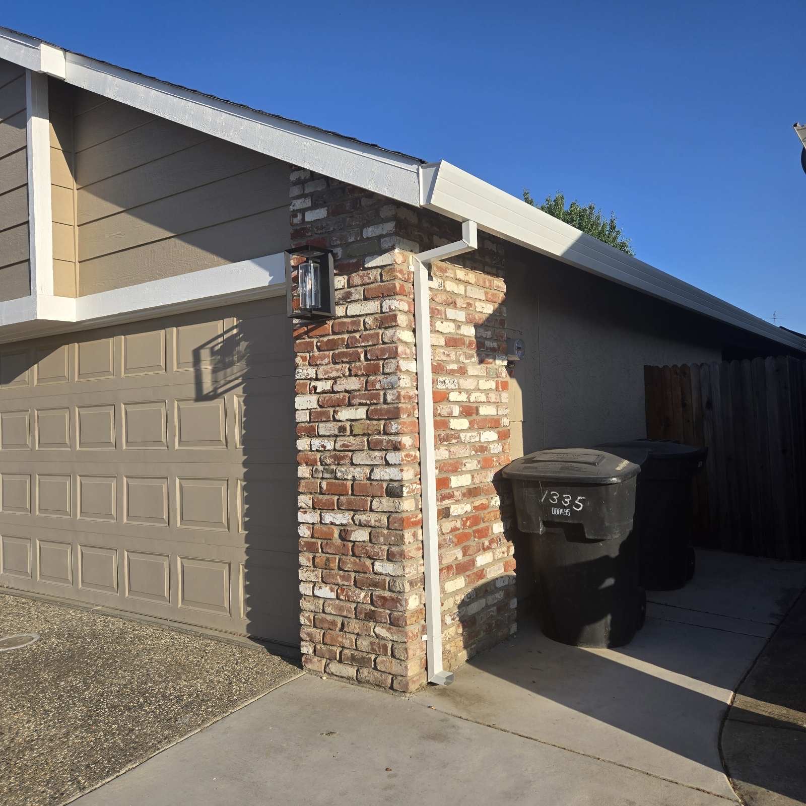 Downspout installed on brick column at Sacramento home
