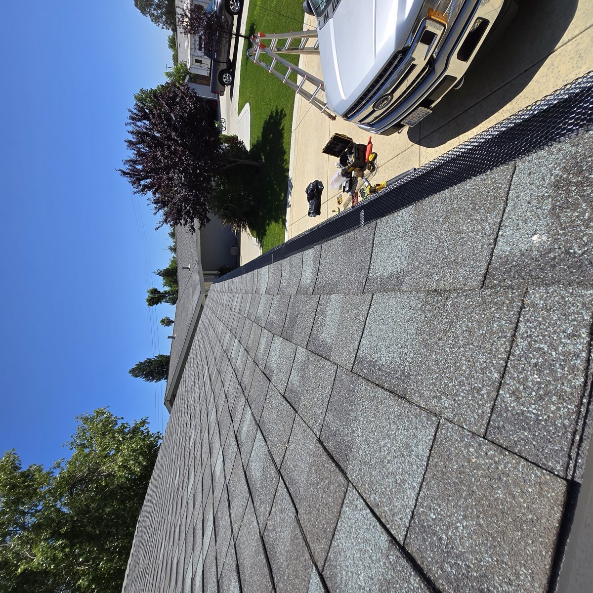 Gutter guard installation along roofline of Sacramento home