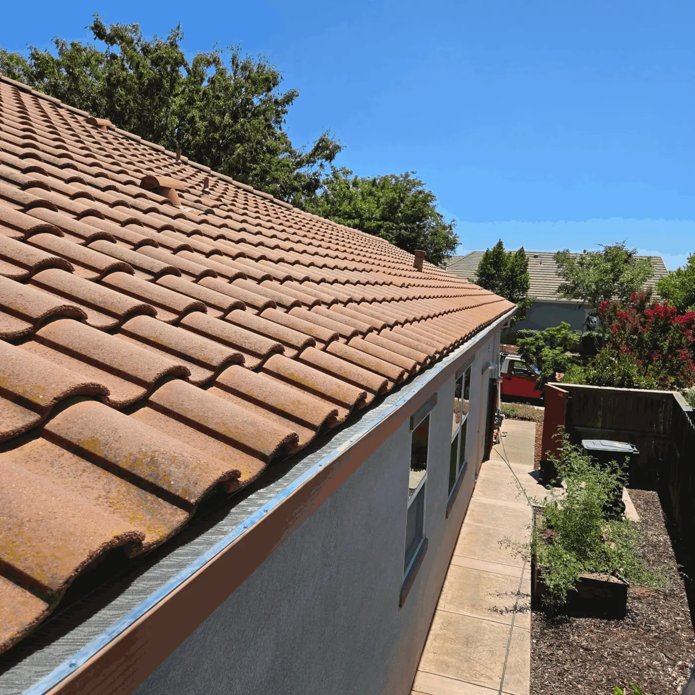 Gutter guard installed along a long roofline on a Sacramento-area home