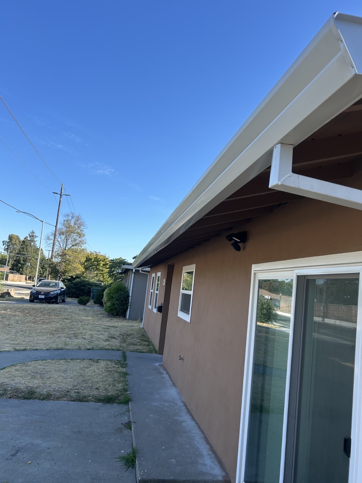 New white gutters installed on ranch-style Sacramento home