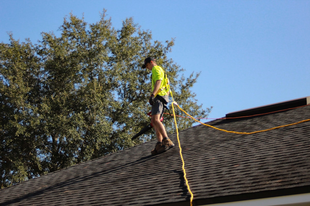Close-up view of residential aluminum gutters on a Sacramento home showing dark streaking pattern on the gutter face
